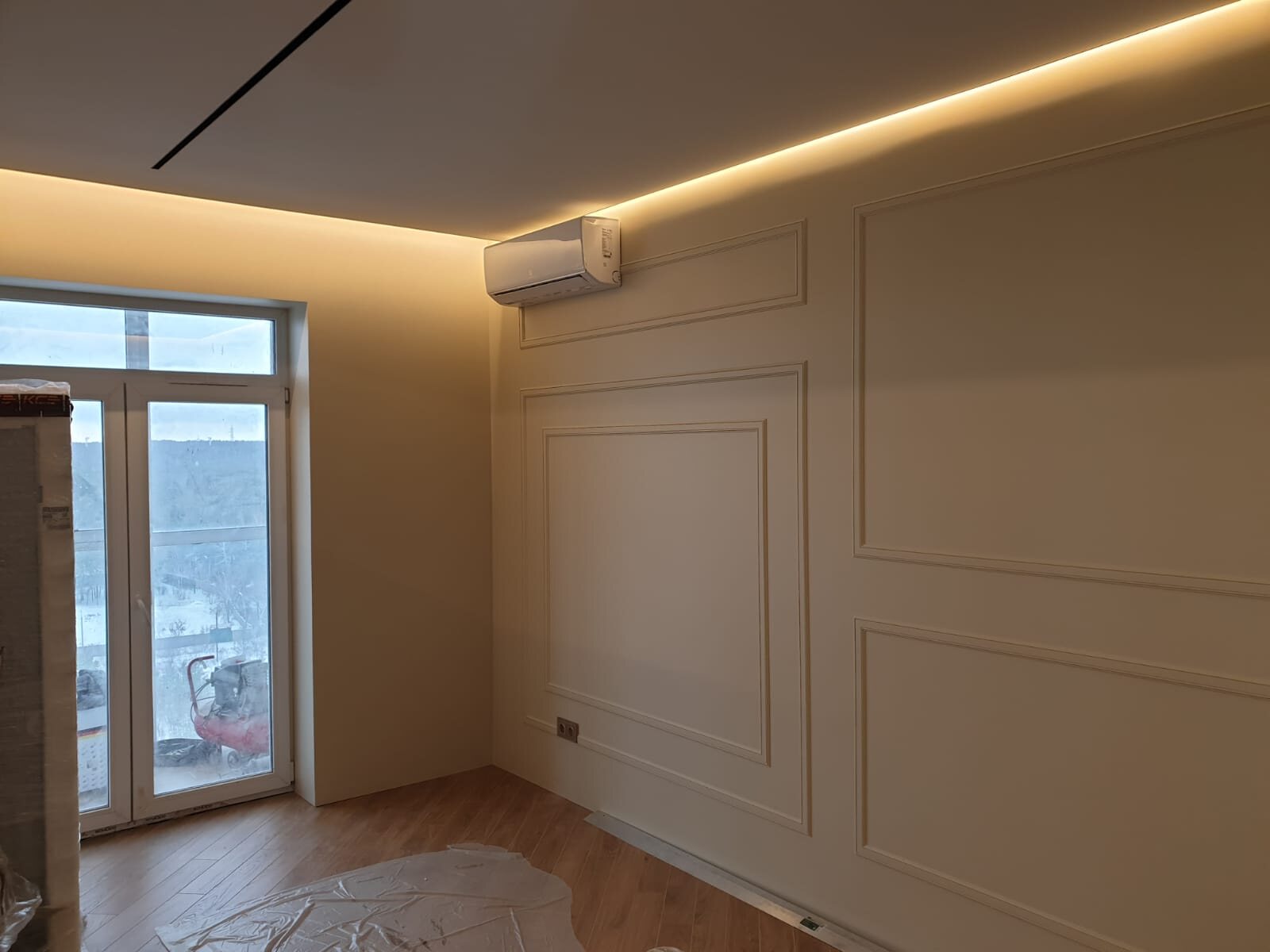 Finished paneled wall with warm perimeter light detail