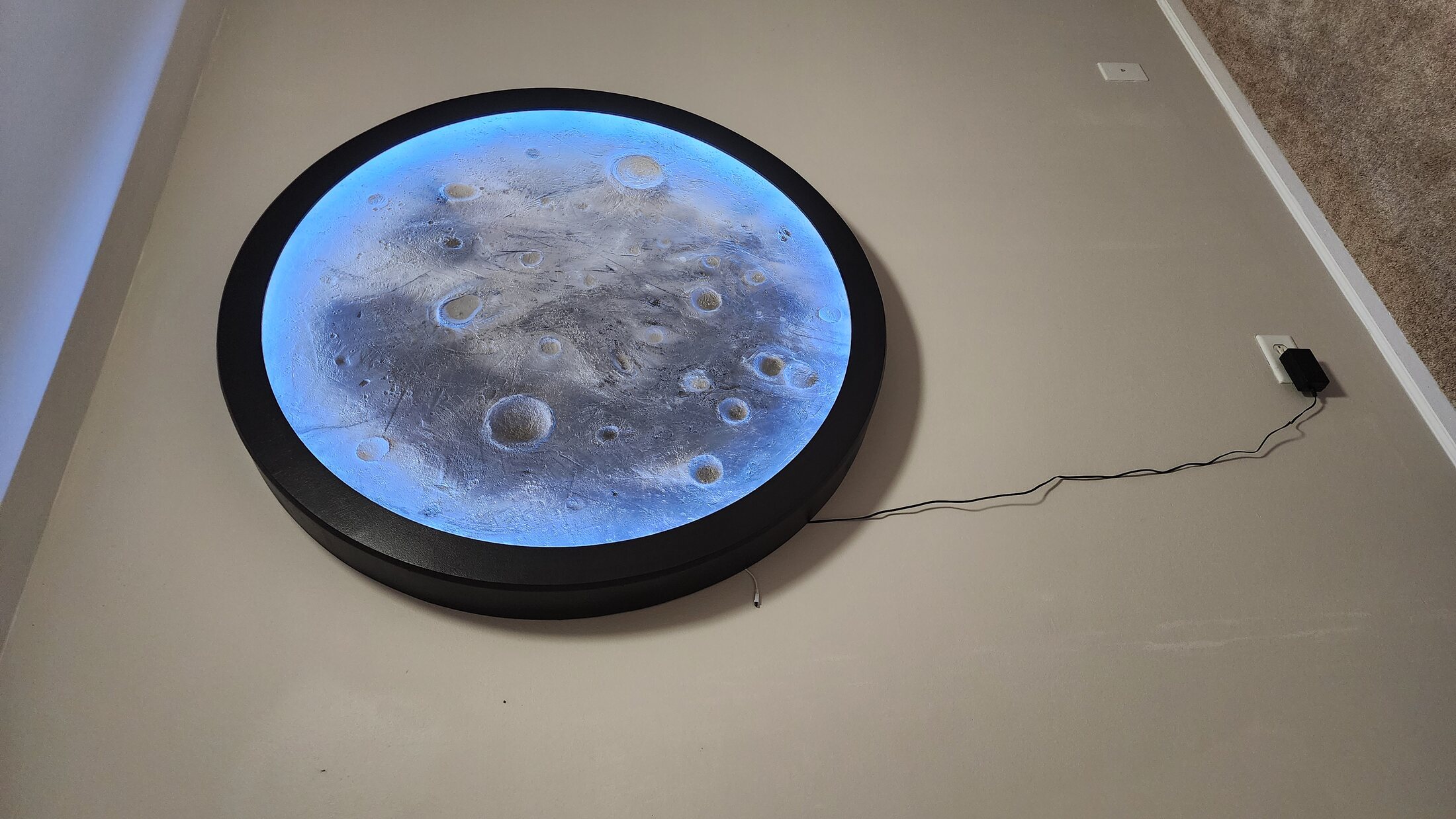 Moon feature illuminated with blue accent light