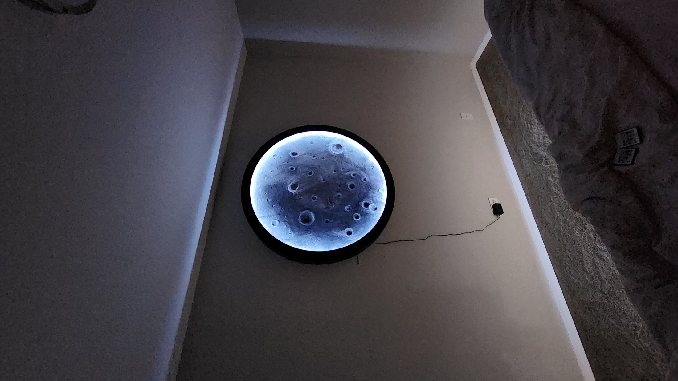 Illuminated moon feature viewed from the doorway