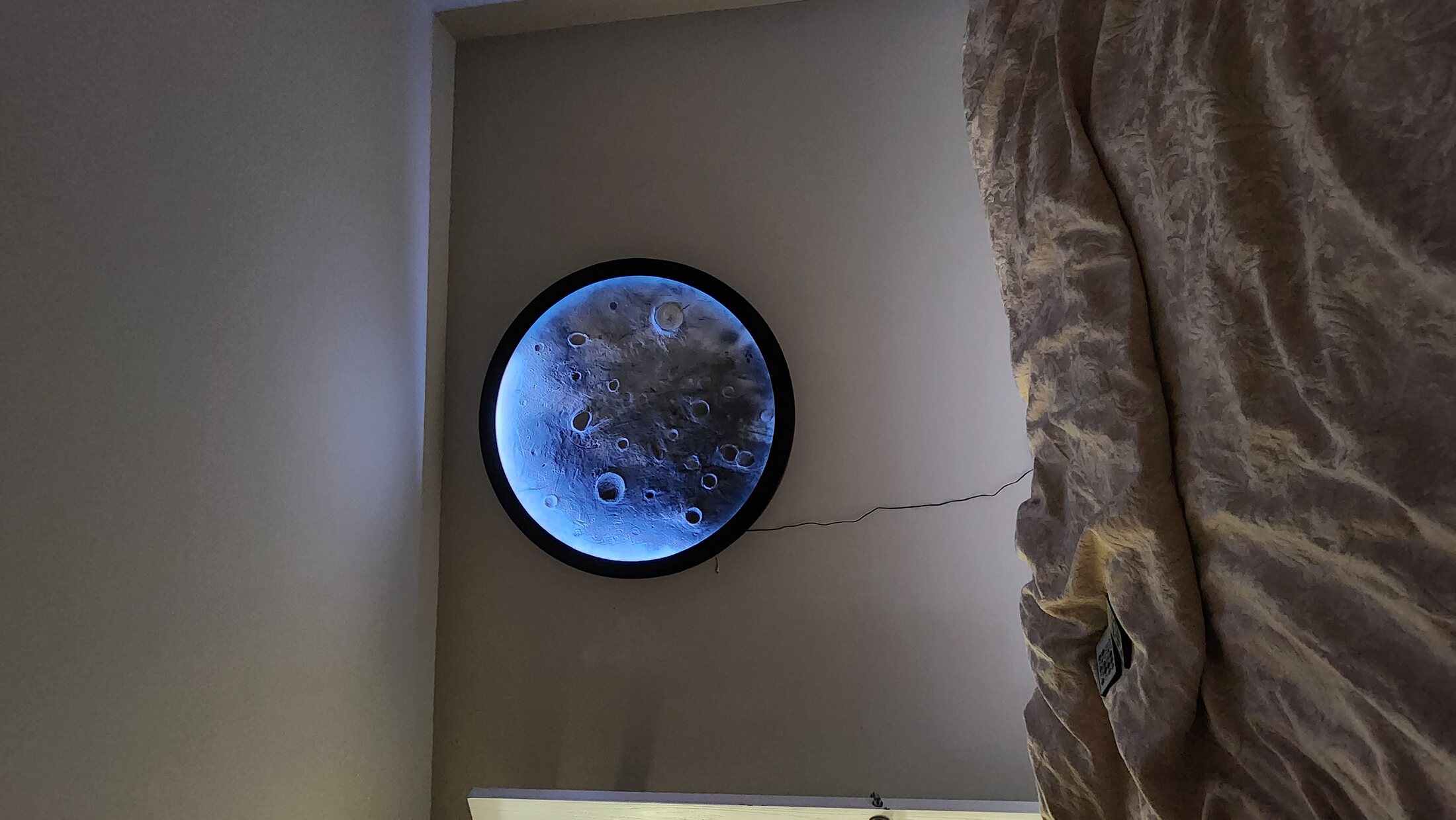 Moon installation framed by a completed interior wall
