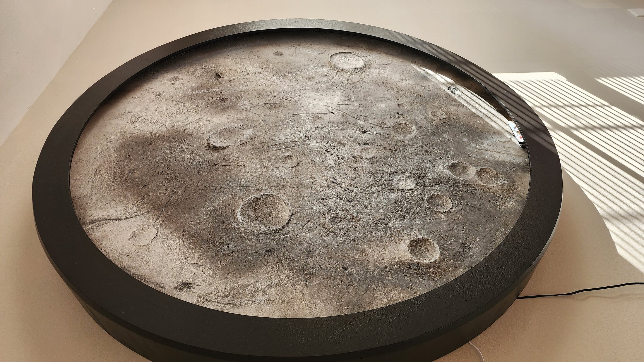 Daylight view of the sculptural moon feature