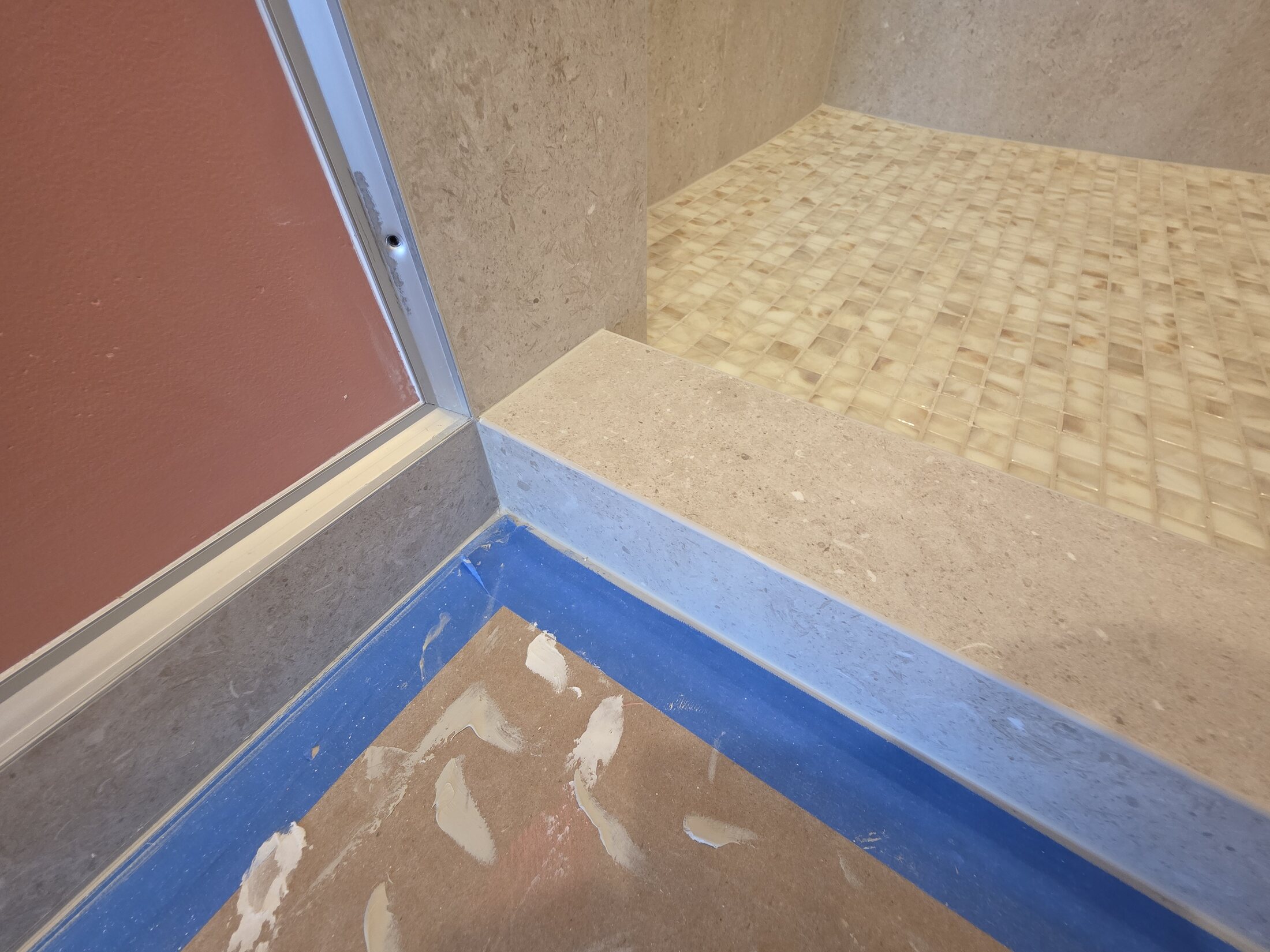 Shower threshold and mosaic transition during installation
